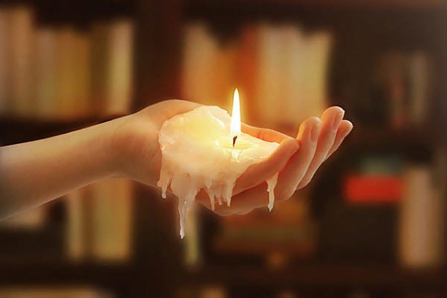 Realistic candle shaped like a human hand